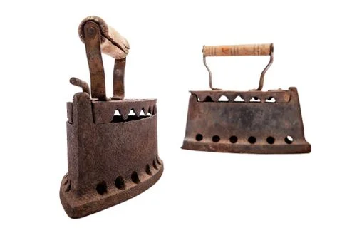 Old rusty iron on a white background. Ironing. Stock Photos