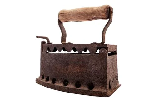 Old rusty iron on a white background. Ironing. Stock Photos