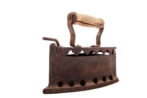 Old rusty iron on a white background. Ironing. Stock Photos
