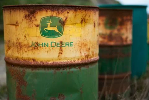 Old rusty John Deere barrels Stock Photos