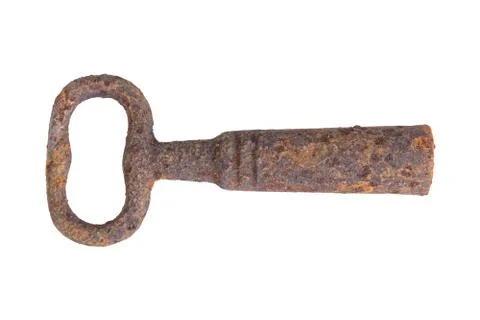 Old rusty key over white background Foto stock