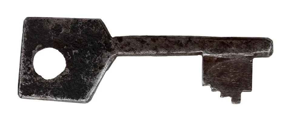 Old rusty key on a white background. Padlock key isolate Stock Photos