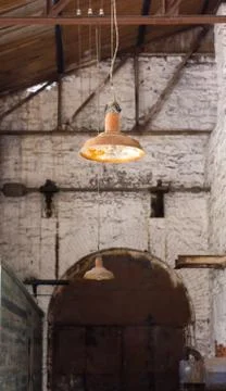 Old rusty lamp hanging in an abandoned factory Stock Photos