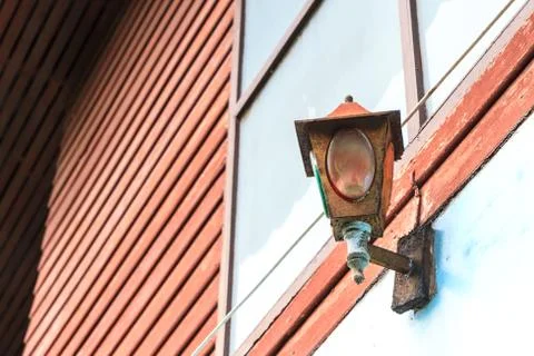 Old rusty lamp on wall Stock-Fotos