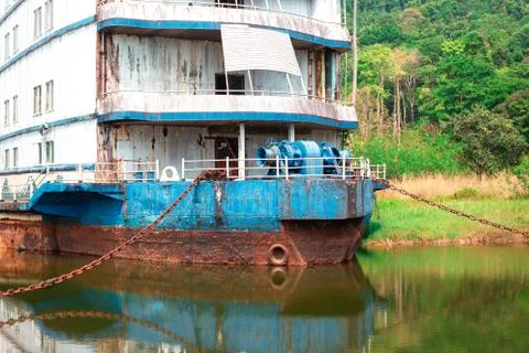 Old rusty large ship stands in the creek. Travel and cruise concept Stock Photos