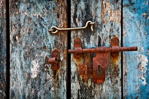 Old rusty latch on the door Stock Photos
