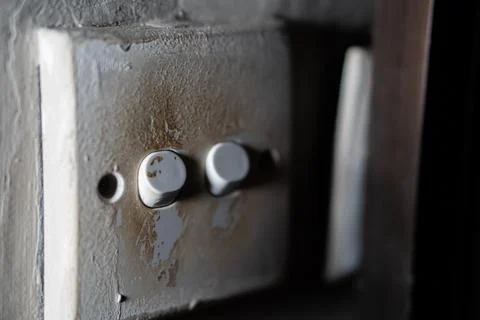 Old rusty light switch with two knobs Fotos de archivo