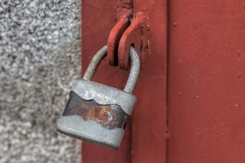 Old rusty lock on old iron gate Stock Photos