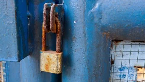 Old rusty Locked Padlock Hanging On City Park Gate Stock Photos