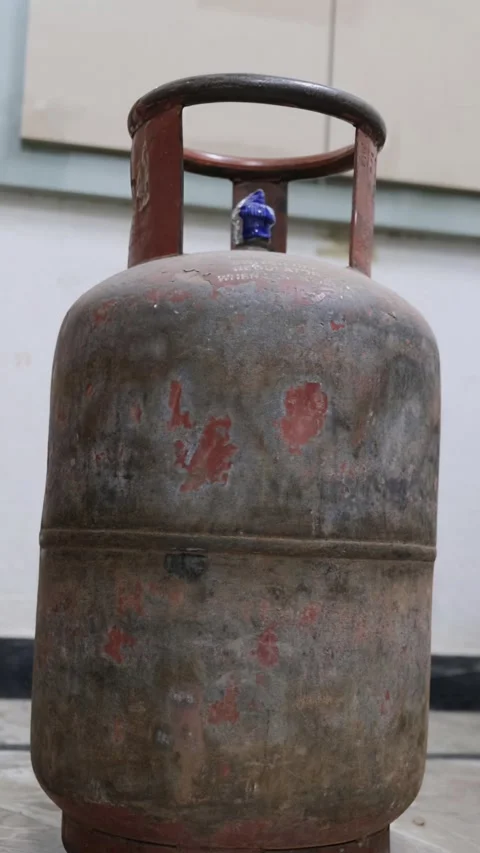 Old rusty LPG gas cylinder on floor Stock Footage 330738593