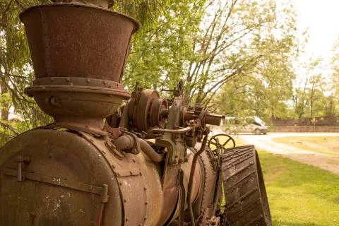 Old rusty machine near the trees Stock Photos