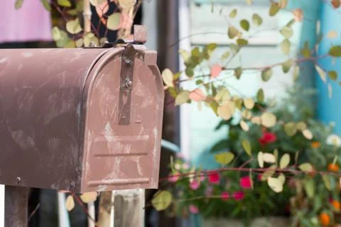 An old rusty mailbox or post box.  Stock Photos