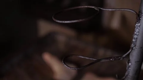 An old rusty metal flower stand with a hook in an abandoned dark house. Stock Footage 311797003