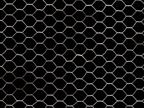 Old, rusty metal net isolated on black Stock Photos