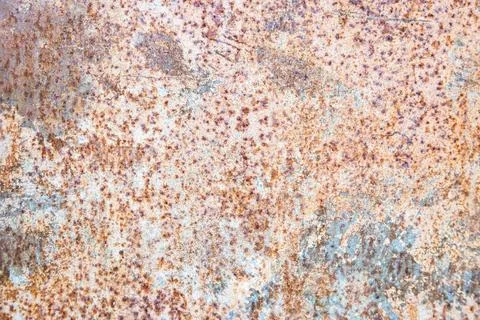 Old rusty metal texture on the surface of an iron sheet with pitting, grunge Stock Photos
