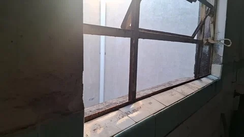 Old rusty metal window frame with bright sunlight video motion Stock Footage 339301847