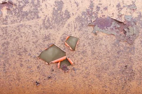 Old rusty metallic surface painted wall with peeling paint chipping Stock Photos