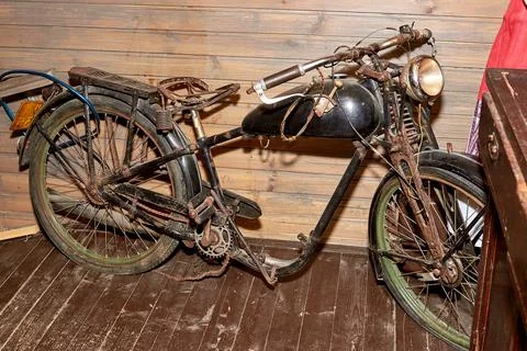 An old rusty moped. old-fashioned transport. Stock Photos