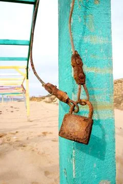 Old rusty padlock. Against the backdrop of the beach. Antique. Stock Photos