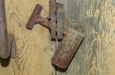Old rusty padlock on the barn door. Long unused lock on the door. Stock Photos