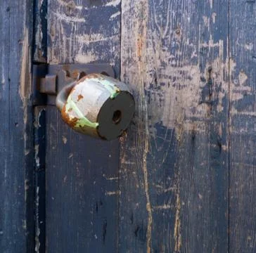 Old rusty padlock on dark Stock Photos