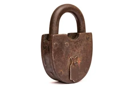 Old rusty padlock isolated on white background, key isolated. Stock Photos