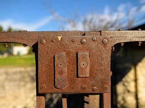Old rusty part of a iron gate Stock Photos