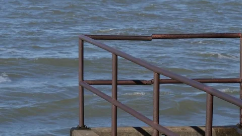 Old rusty Pier on the Great Lakes water splashing slider movement Stock Footage 82046901