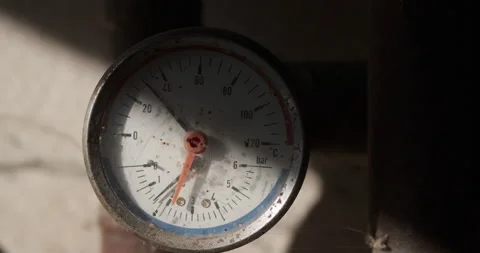 Old rusty pipe with an analog meter gauge Stock Footage 165507836