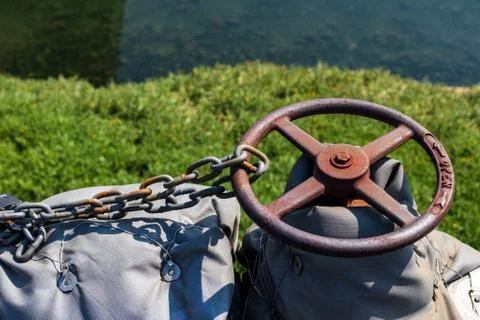 Old rusty pipe valve chained and locked in to position Stock Photos