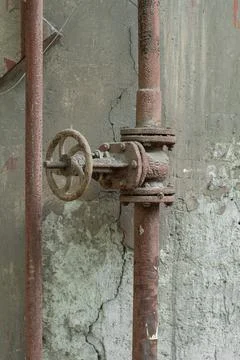 Old rusty pipe with valve, close-up. Stock Photos