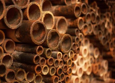 Old rusty pipes decorating wall background design, wallpaper, backdrop. archi Stock Photos
