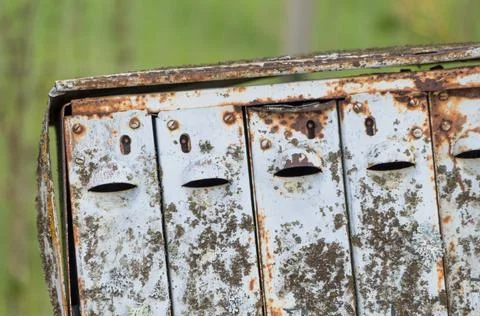 An old rusty post-box with a smiley face Stock Photos