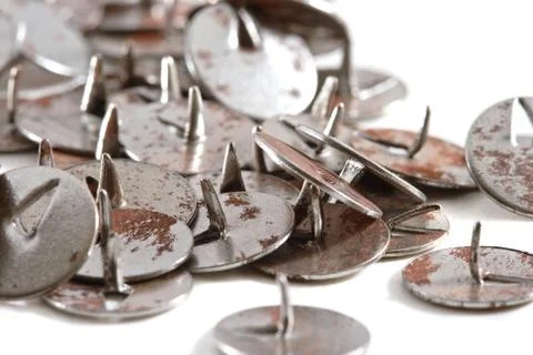 Old rusty push-pins Stock Photos