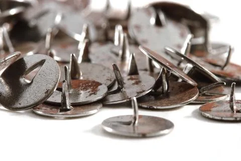 Old rusty push-pins Stock Photos