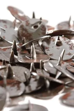 Old rusty push-pins Stock Photos