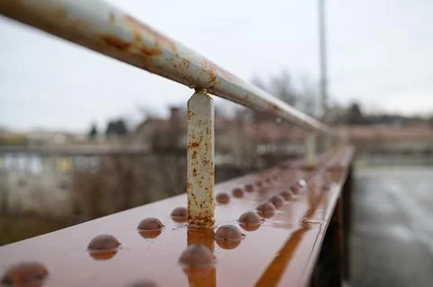 Old rusty railing of a small bridge Stock Photos