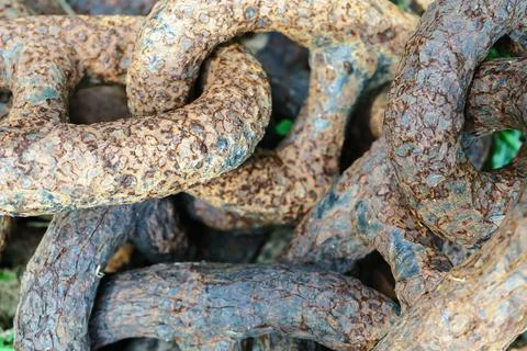 An old rusty rough chain lies close up Stock Photos