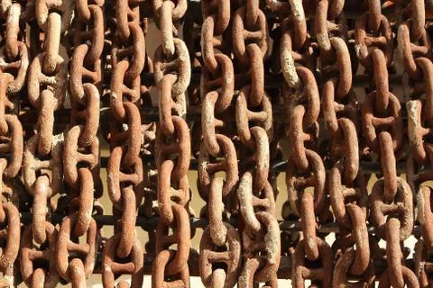 Old rusty ship anchor chain links close up. Stock Photos
