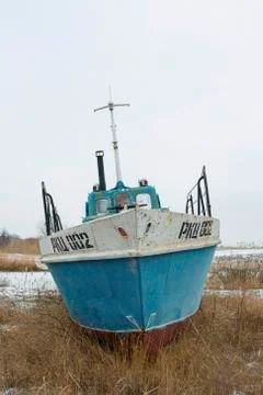 Old rusty ship on ashore Stock Photos