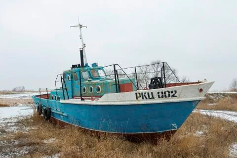 Old rusty ship on ashore Stock Photos