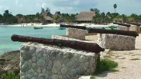 Old rusty ship guns on the Caribbean seashore. Akumal Stock Footage 54086126