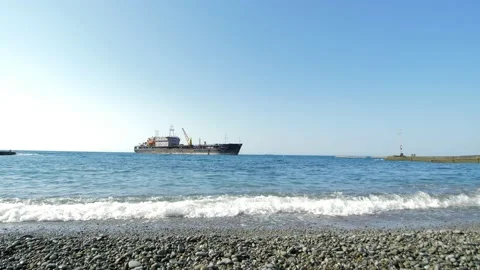 An old rusty ship is standing in the Black Sea. The old cargo ship sailed closer Stock Footage 159573169