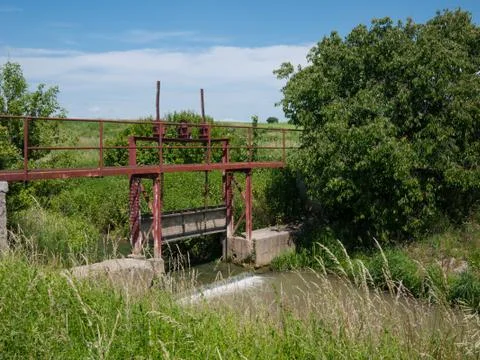 Old rusty sluice on the river Stock Photos