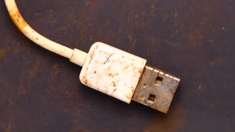 Old rusty smartphone usb cable rotating Stock Footage 250098730