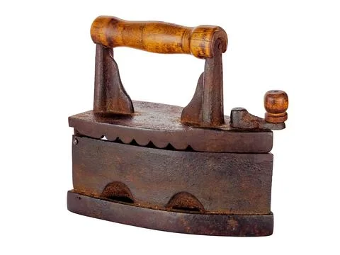 An old rusty smoothing iron close-up isolated on a white Stock Photos