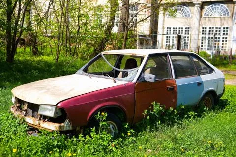 Old rusty Soviet car with broken glass. Stock Photos