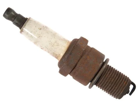 Old  rusty spark plug, isolated on a white background. Stock Photos