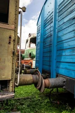 Old rusty steam train details weathered textures and colors in a railway yard Stock Photos