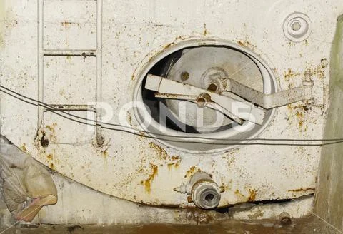 An old rusty stove for heating premises in winter in an abandoned and destroy Stock Photos
